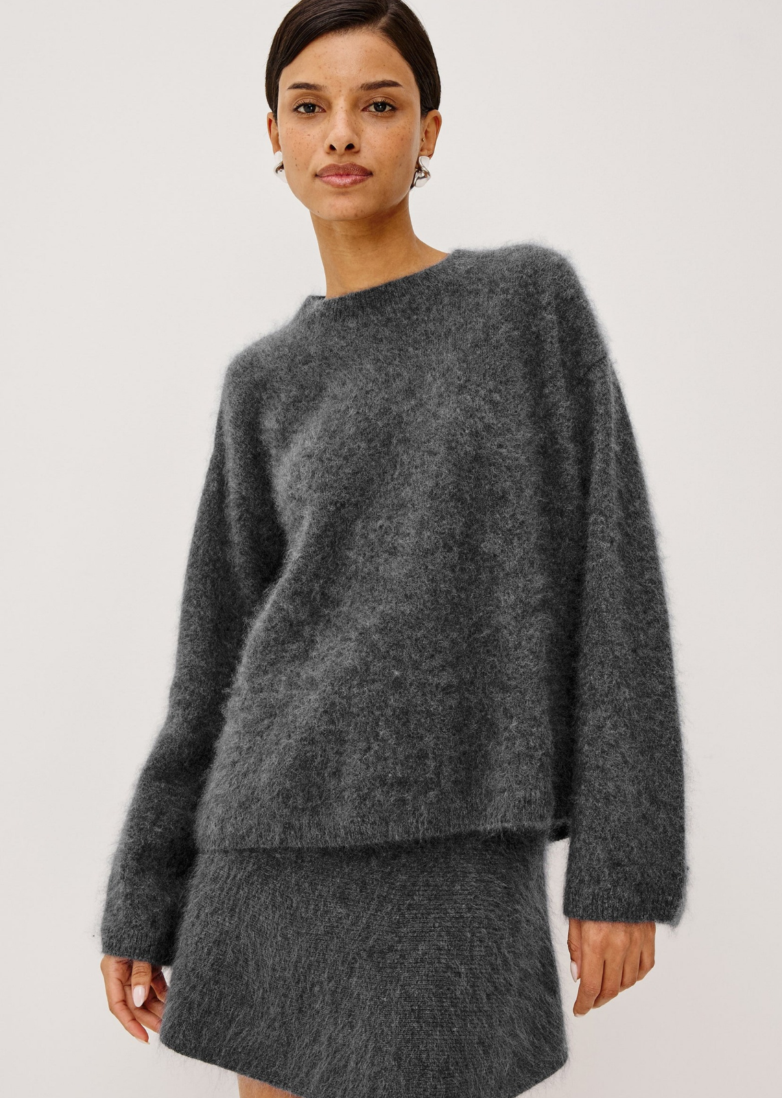 The Joel Sweater is an oversized brushed wool pullover with a mock neckline, dropped shoulders, and a relaxed, boxy fit.