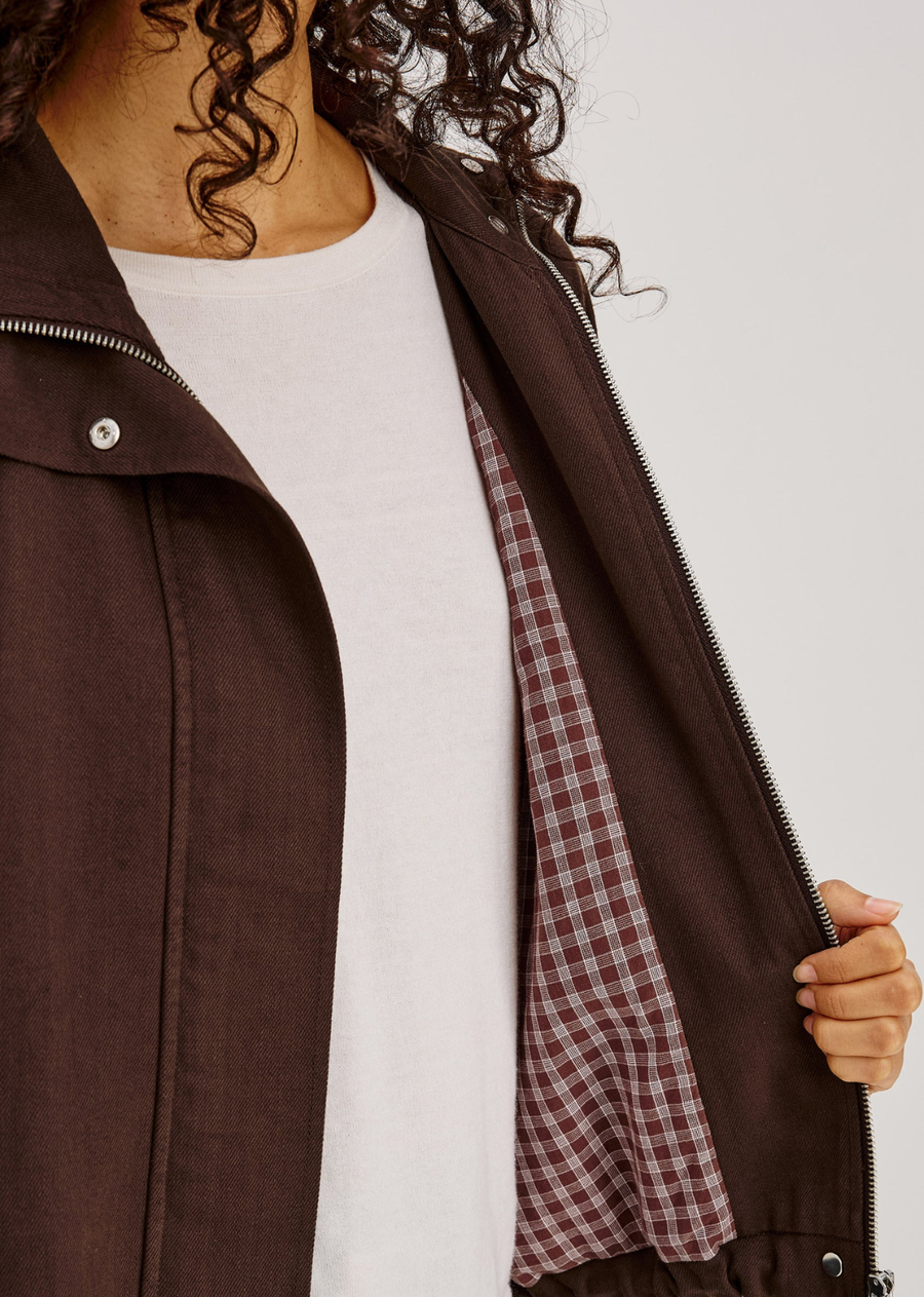Softly draped, perfectly shaped. The Blake Jacket is crafted from soft, drapey TENCEL denim in a relaxed, oversized fit with a high funnel neck and double-button closures. Long dropped-shoulder sleeves with elastic cuffs and a cropped drawstring hem complete the look.