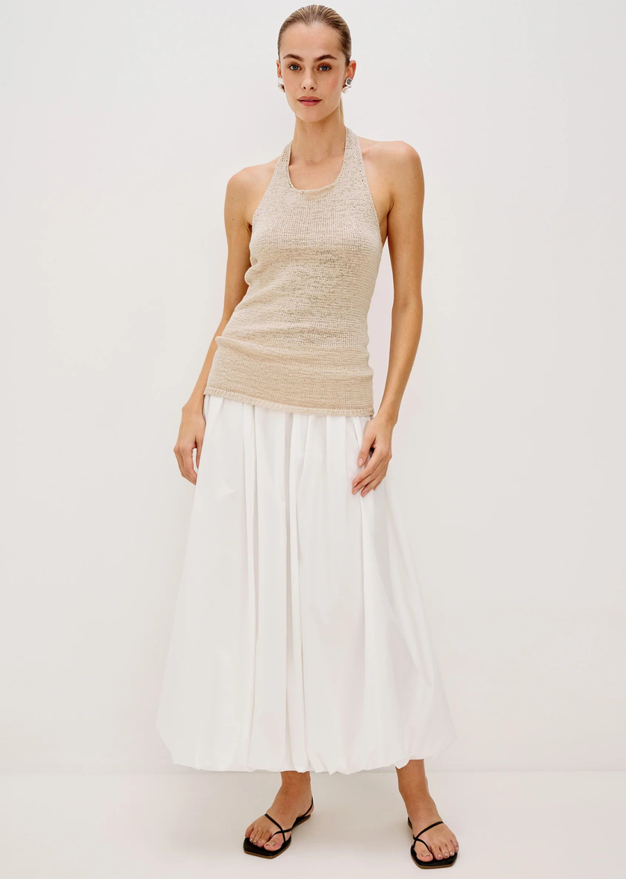 The cotton poplin Cala is a full midi skirt designed with a bubble hem. Finished with an elastic waistband for extra comfort—plus, pockets.