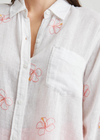 Rails Charli-Hibiscus  Embroidery. The Charli Shirt is a breezy take on the classic button-down. Made of a lightweight linen blend, white serves as the background of a hibiscus embroidered pattern. It's designed and tailored for refinement, but can serve both laid back and office casual styles.