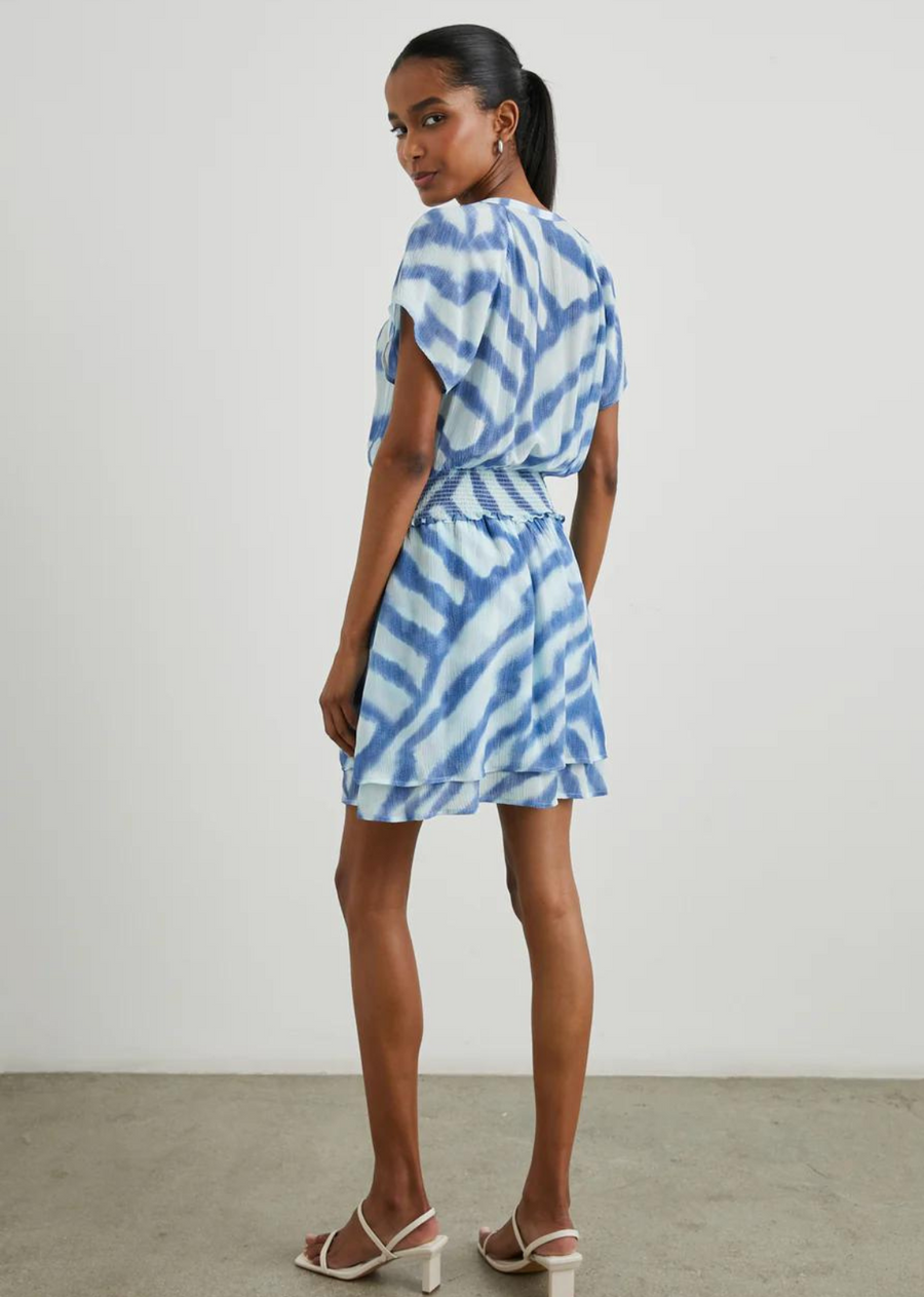 Rails Karla Dress-Blue Watercolour Stripes A super easy to wear dress from our favourite Summer dress brand Rails.&nbsp; Crafted from lightweight rayon crepe with a short sleeve, a flattering v neckline, cap sleeves, smocked elasticated waistline and a feminine double layered tiered skirt you can simply slip this on and forget about it.&nbsp; In a pretty blue print this is perfect paired with a pair of white trainers or a pretty sandal!