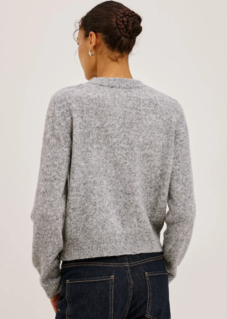 The Millie is an ultra-soft wool blend take on a wardrobe classic, finished with delicate floral details and contrast buttons. Wear it solo or layered for added warmth.