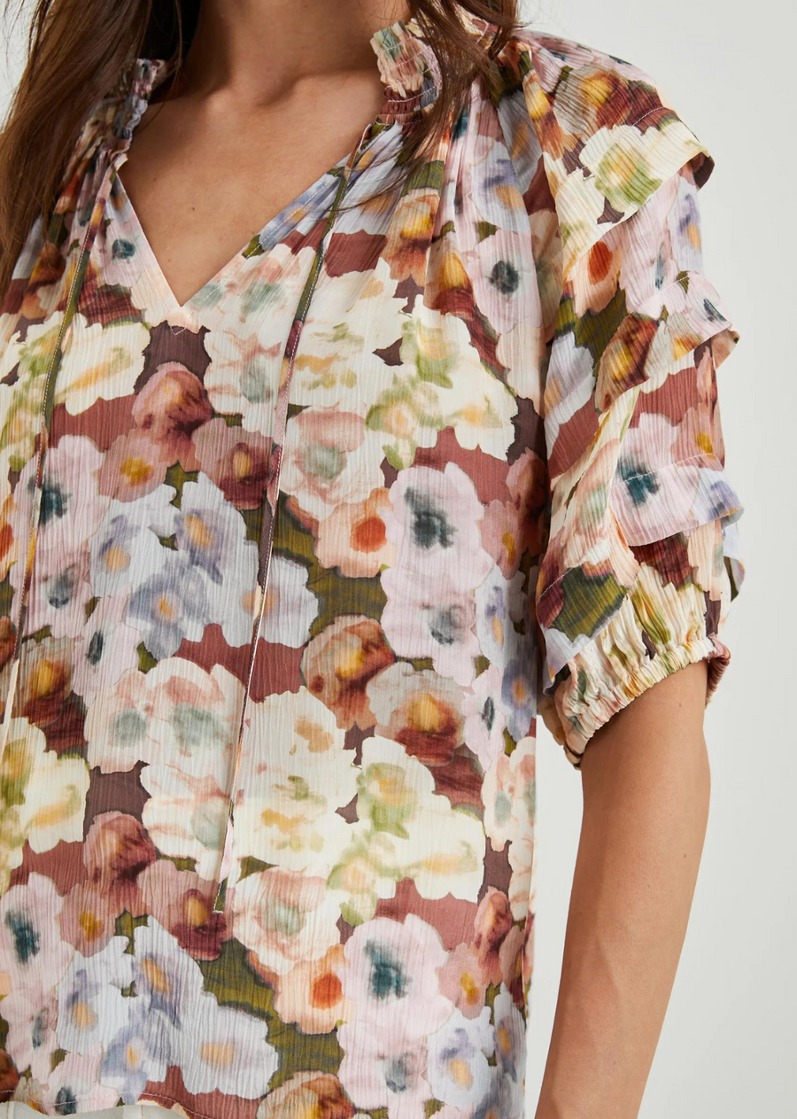 Rails Paris Top- Painted Floral. Elevate your wardrobe with this feminine top. This style features smocking at the collar, deep pleats on the sleeves, and elastic at the sleeve opening.