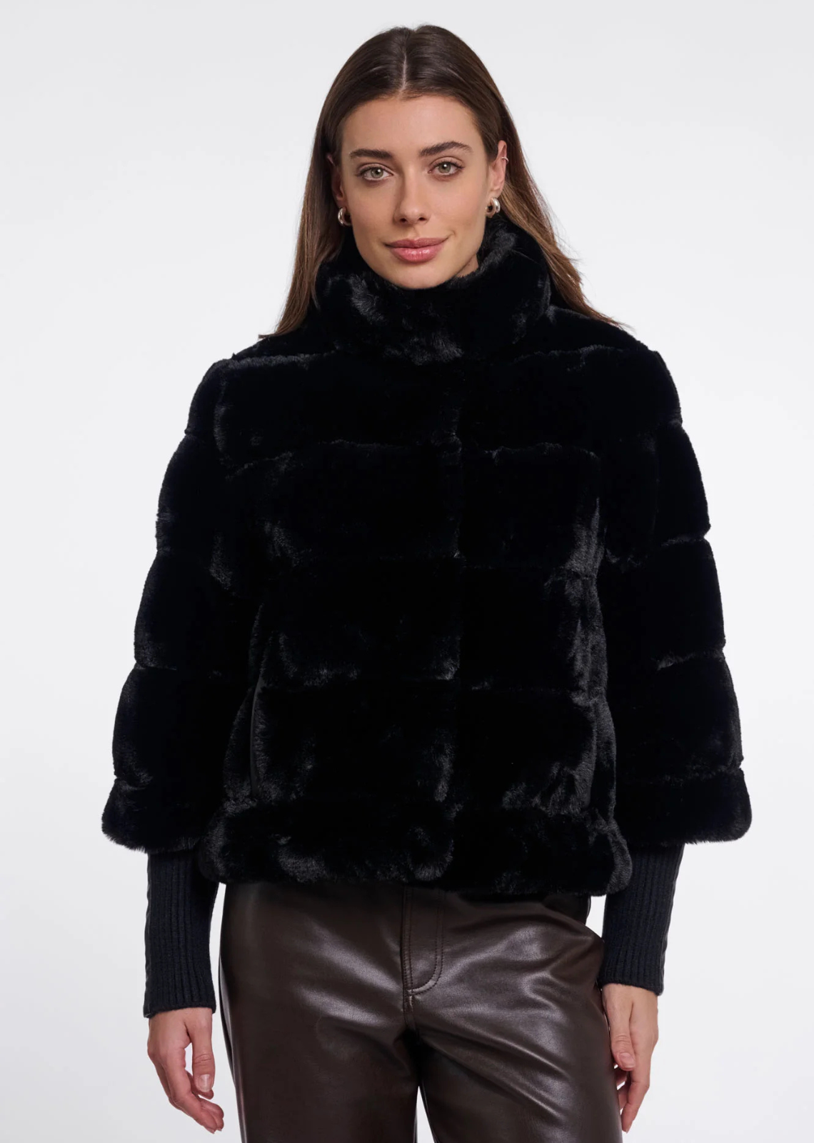Imagine yourself wrapped in the luxurious softness of the Feline Faux Fur Jacket. Crafted from ultra-soft faux fur, this versatile style combines the warmth and coverage of a coat with the ease and versatility of a jacket. Designed with a snap-button closure, a stand-up collar and convenient side slit pockets, it offers both comfort and a sophisticated look. Thanks to its detachable sleeves, the Feline provides multiple styling options throughout the season. Wear it as a warm faux fur jacket on colder days 