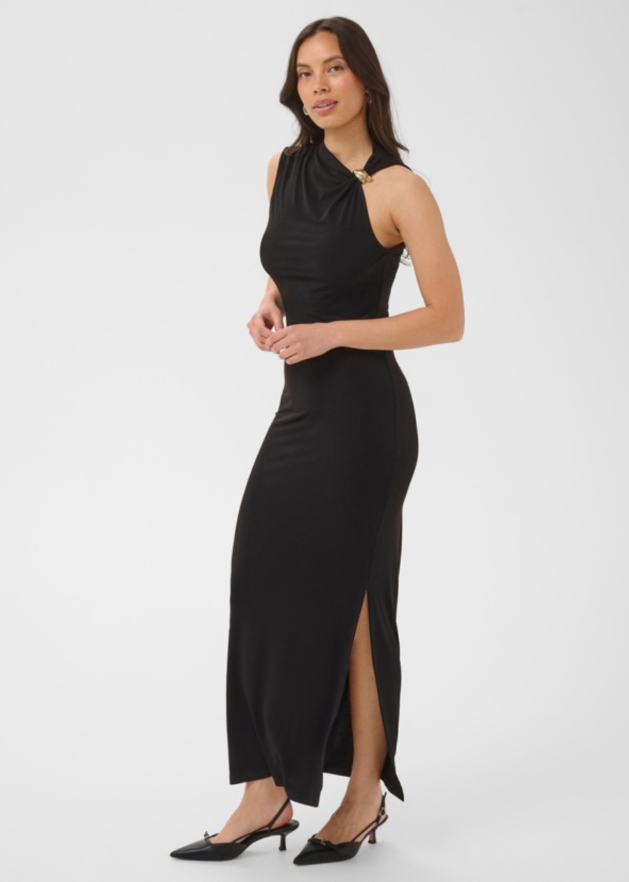This sleeveless long black dress features a fitted silhouette and a high neckline that gathers at one side with a metallic accent. The clean design highlights an asymmetric shoulder detail for a distinctive look with a smooth appearance.