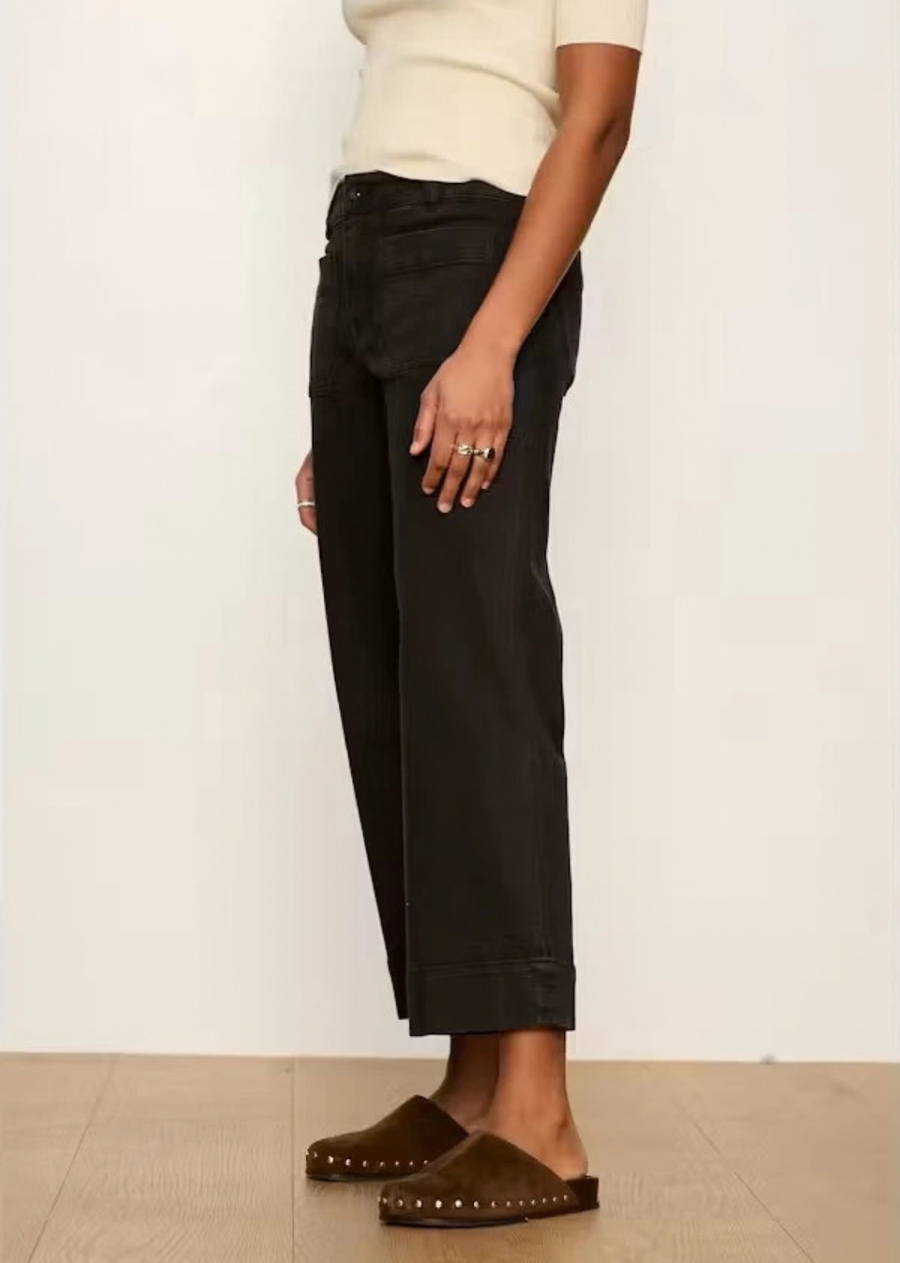 These dark charcoal/faded black pants combine utilitarian workwear elements with a modern, relaxed silhouette. Offering a laid-back yet structured look, they blend casual comfort with everyday versatility—perfect for effortless transitional styling.