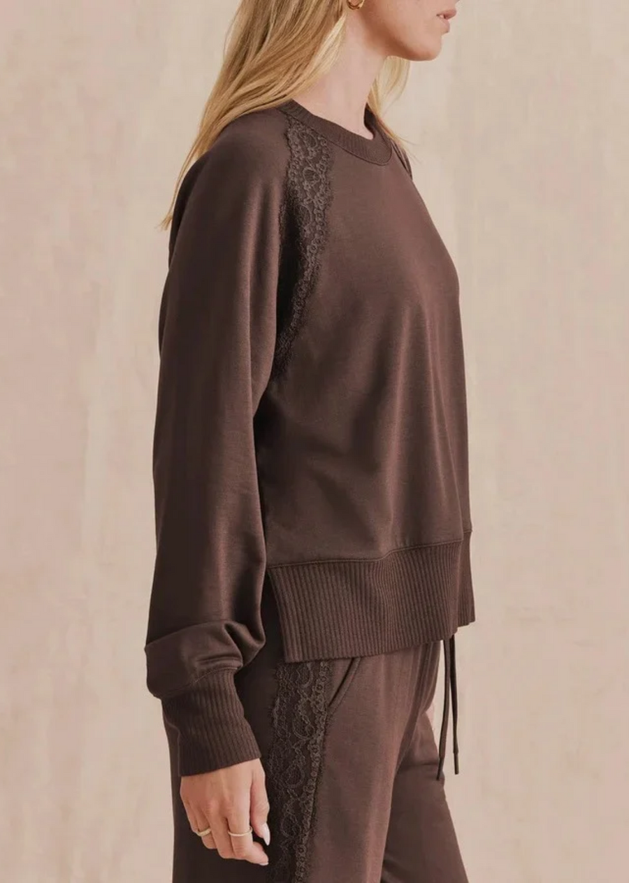 The softer side of loungewear. We added delicate lace trim along the shoulders of this classic crewneck and kept the easy fit and feel you love. Perfect with the matching Lace Trim Jogger or your favorite denim.