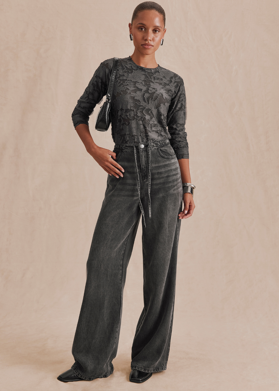 Feminine meets functional in our Cecelia Floral Long Sleeve Tee-- a refined top that feels casual but looks trés chic. Made from a sheer burnout fabric with a lovely embroidered floral pattern. It's bodycon fit is perfect for layering and tucking into jeans. Top it over your own cami for added coverage.