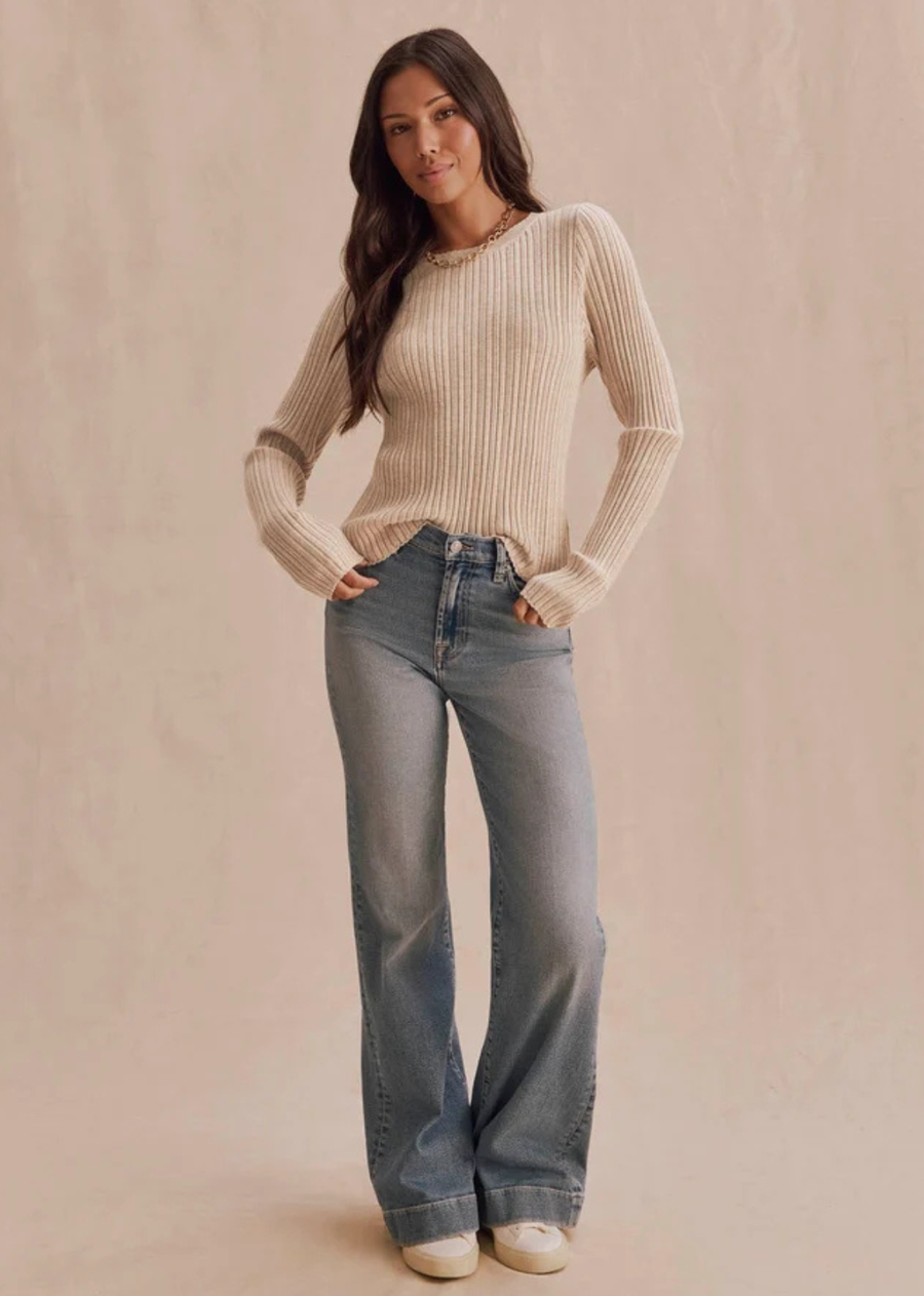 A ribbed pointelle sweater with a fitted silhouette and soft textured feel. The Georgie Pointelle Polo adds a feminine touch to everyday layering with delicate detailing and an easy shape that pairs well with denim, trousers, and skirts.