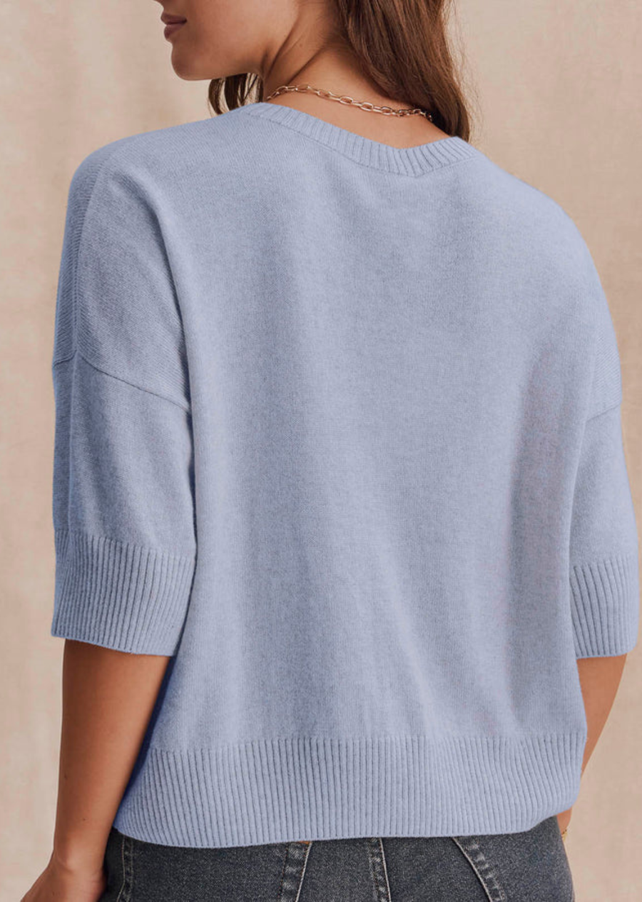 A soft short sleeve sweater with a clean silhouette and easy drape. The Georgie Short Sleeve Sweater brings a refined feel to denim, trousers, and layered looks.