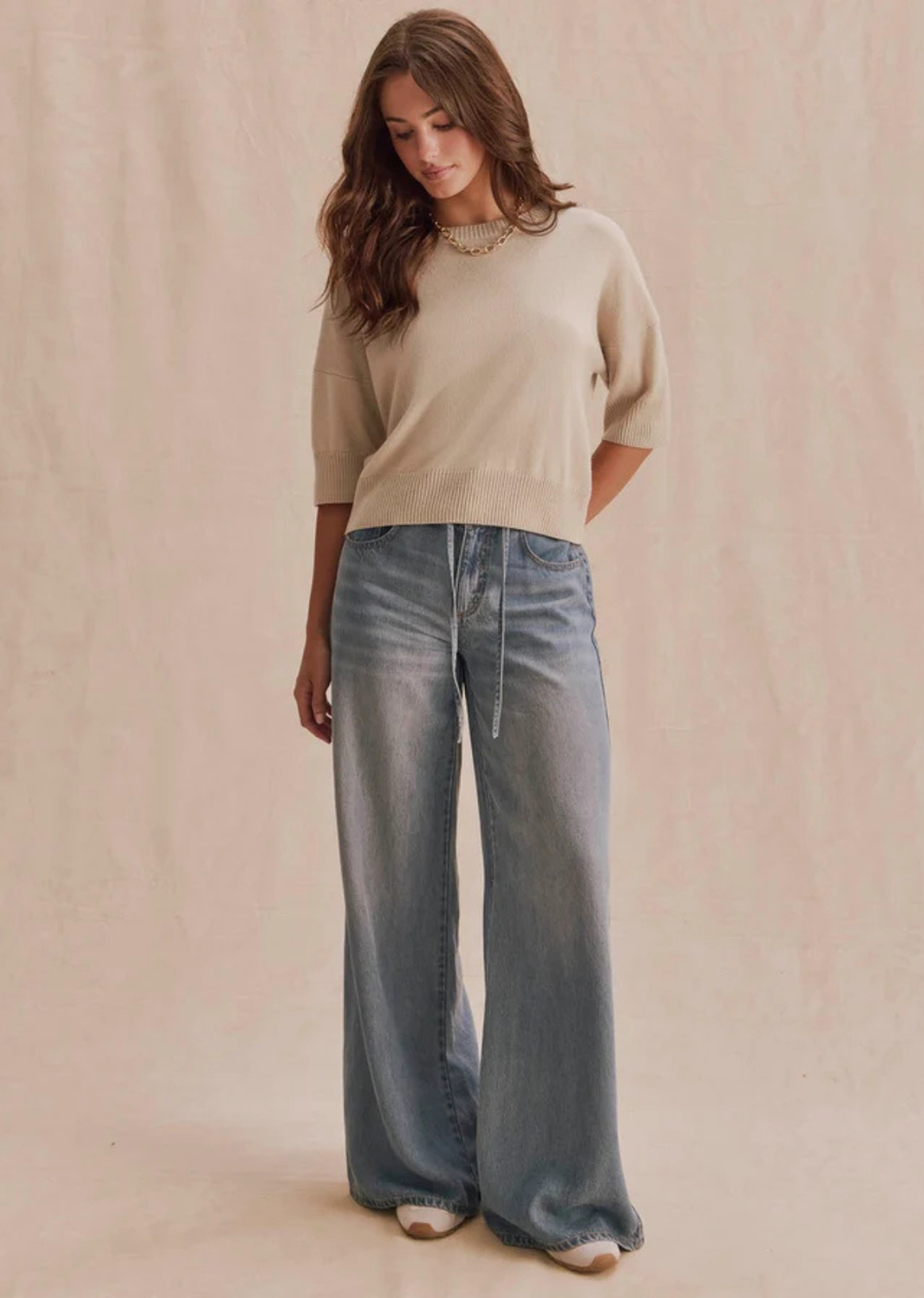 A soft short sleeve sweater with a clean silhouette and easy drape. The Georgie Short Sleeve Sweater brings a refined feel to denim, trousers, and layered looks.
