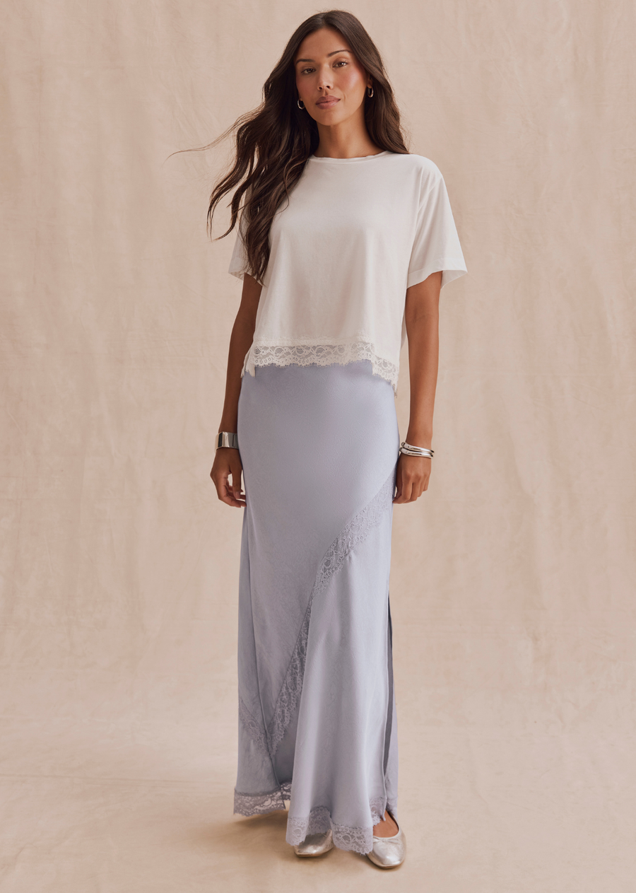 A satin-inspired maxi skirt finished with delicate lace details and a front slit for added movement. The Penelope Lace Front Skirt brings a romantic feel to sweaters, tanks, and dressed-up layers alike.
