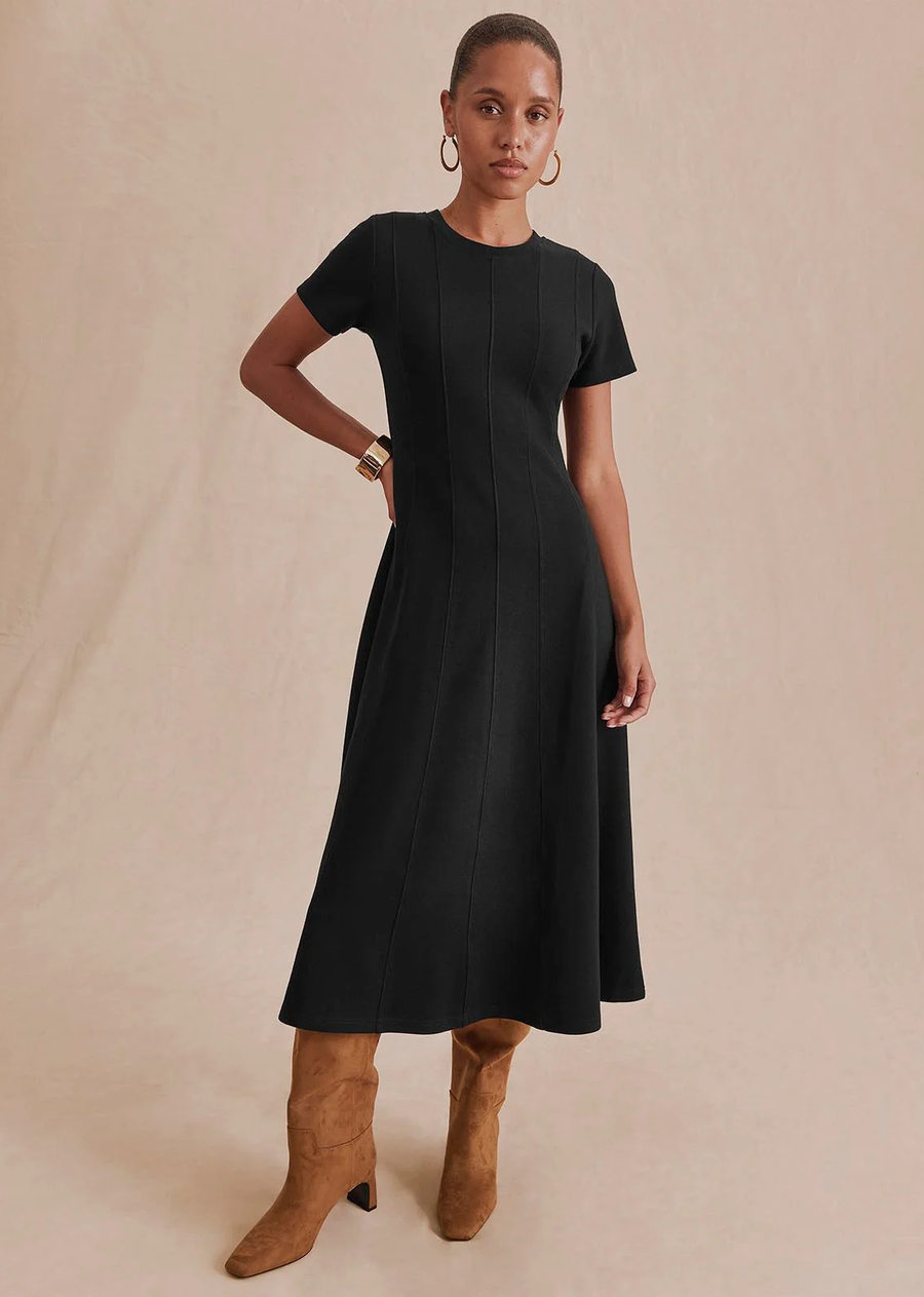An easy knit dress with a polished feel. Designed with a flattering fit-and-flare silhouette, vertical seam detailing, and soft stretch, it skims the body before flowing into a graceful midi-length hem.