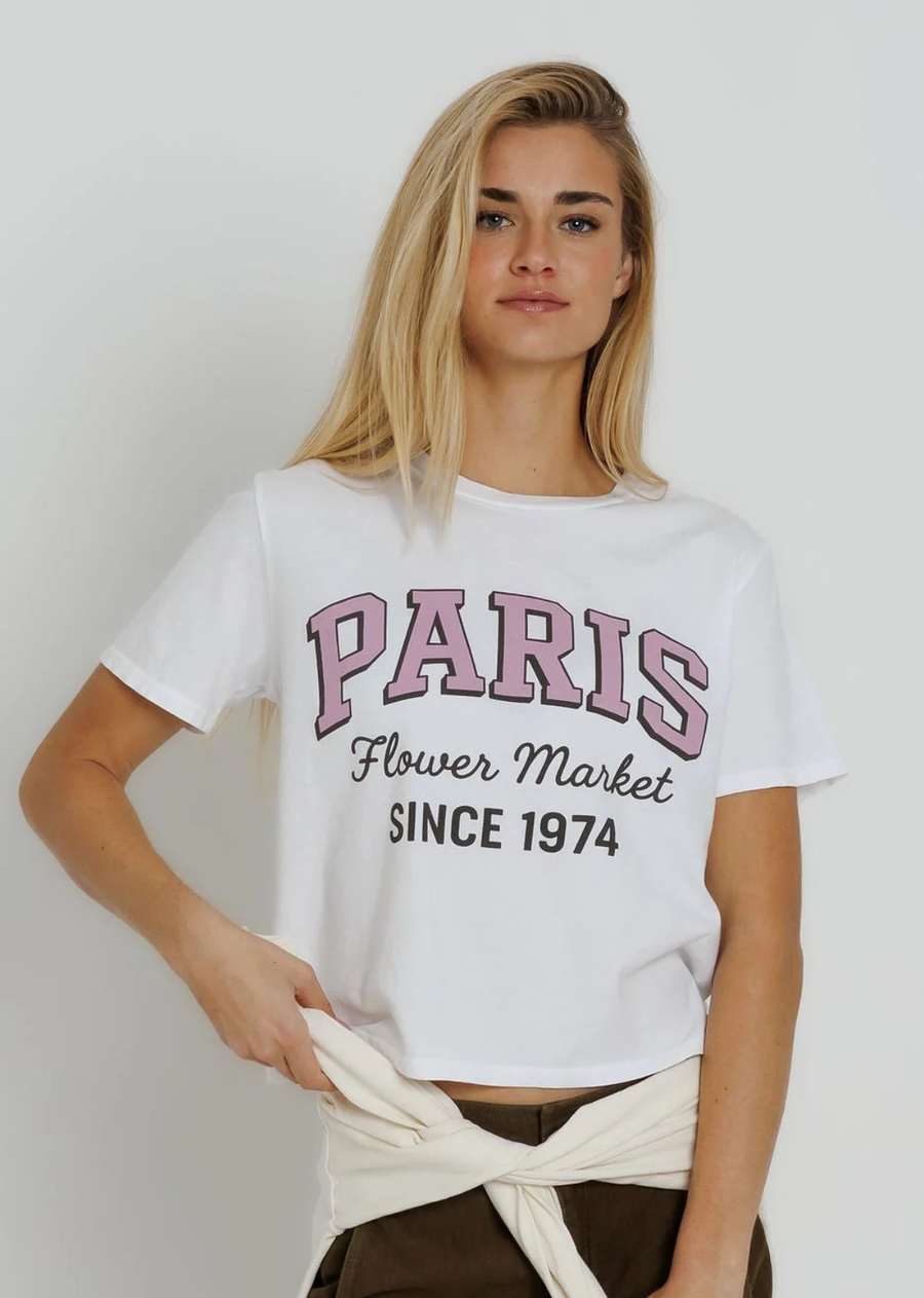 Our Everyday Boxy Tee blends comfort and style with a timeless fit and soft fabric. Hitting at the denim line, it provides a relaxed, flattering look with just the right amount of ease.

The Paris Flower Market Angel Tee brings a little Parisian charm to your everyday. Sweet, romantic, and perfectly nostalgic, it’s inspired by sidewalk flower stands, fresh bouquets, and slow mornings in Paris. Made for café stops, market strolls, and dreaming of your next trip.