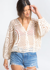 Sunrise Crochet Wrap Top. The possibilities are endless with this classic bohemian crochet-knit top. Featuring voluminous long sleeves, a surplice wrap front, and&nbsp;an elastic hemline. We love to throw this effortless style over our swimsuit at the beach for a quick cover-up, or styled over a cami with jean shorts.