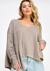 Designed to add shape and texture to absolutely any style, this cool thermal top is featured in a drapey, oversized fit and classic waffle knit fabrication for added dimension