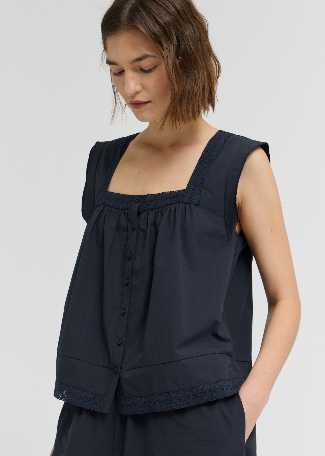 Tara Eyelet Trim Sleeveless Top
