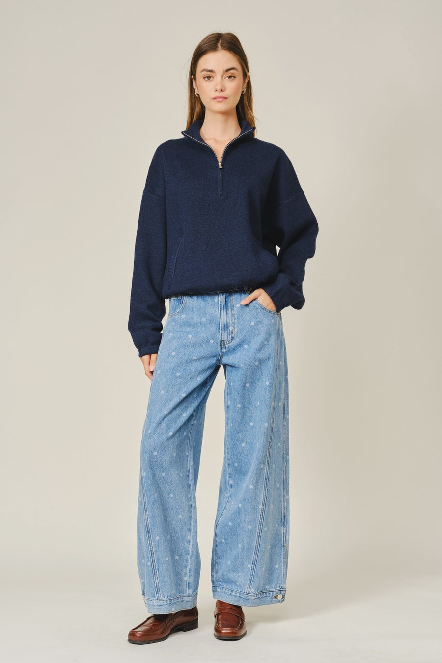 Add a playful twist to your everyday denim with The Eloise Polka Dot Curved Seam Barrel Jeans. Designed with an allover polka dot print and modern curved seam detailing, these statement jeans feature a relaxed barrel-leg silhouette that offers effortless style and all-day comfort. Functional side and back pockets make them as practical as they are chic, while the soft, durable denim is perfect for everyday wear. Pair them with your favorite basics, sweaters, or blouses for an easy boutique-inspired look you