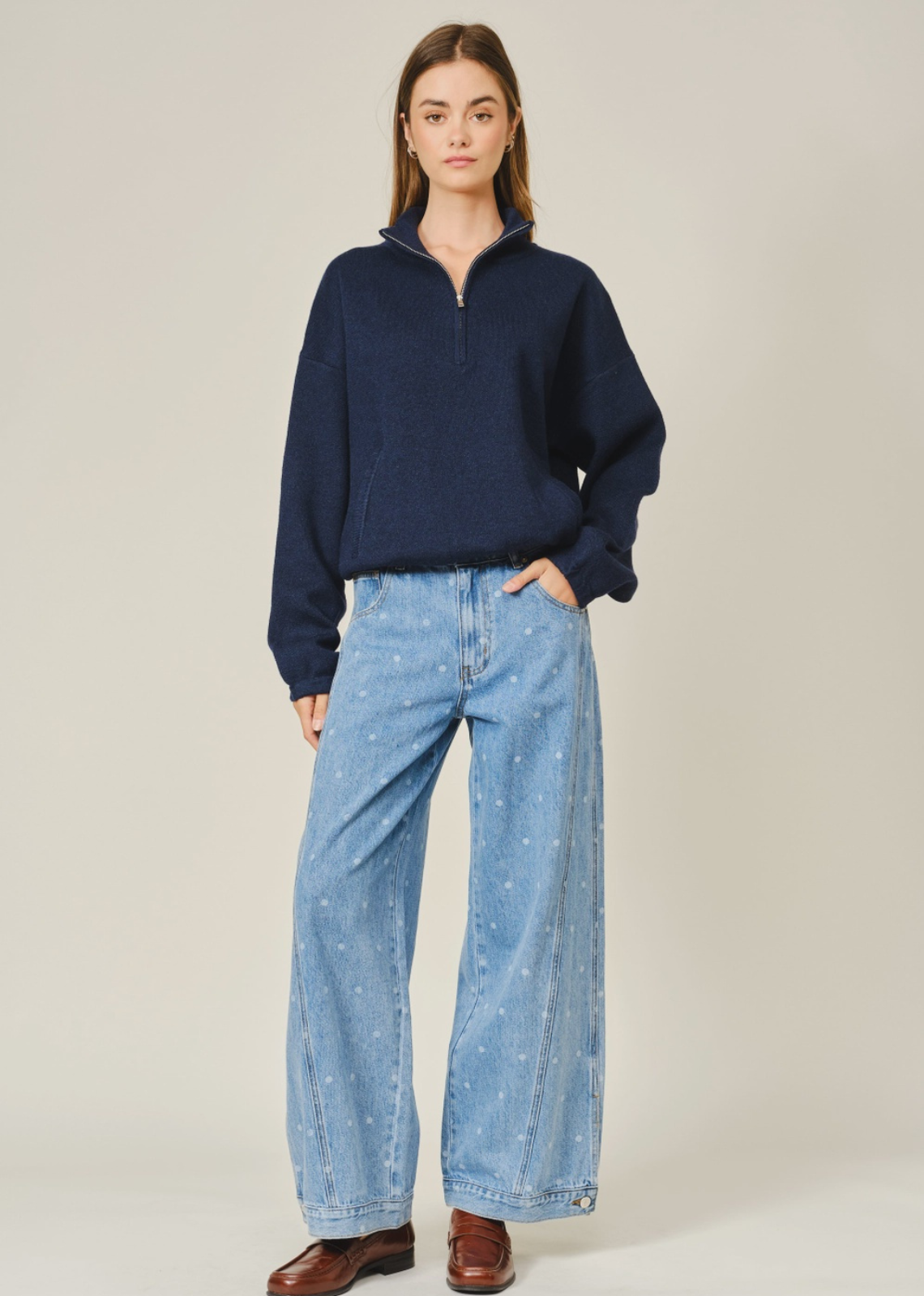 Add a playful twist to your everyday denim with The Eloise Polka Dot Curved Seam Barrel Jeans. Designed with an allover polka dot print and modern curved seam detailing, these statement jeans feature a relaxed barrel-leg silhouette that offers effortless style and all-day comfort. Functional side and back pockets make them as practical as they are chic, while the soft, durable denim is perfect for everyday wear. Pair them with your favorite basics, sweaters, or blouses for an easy boutique-inspired look you