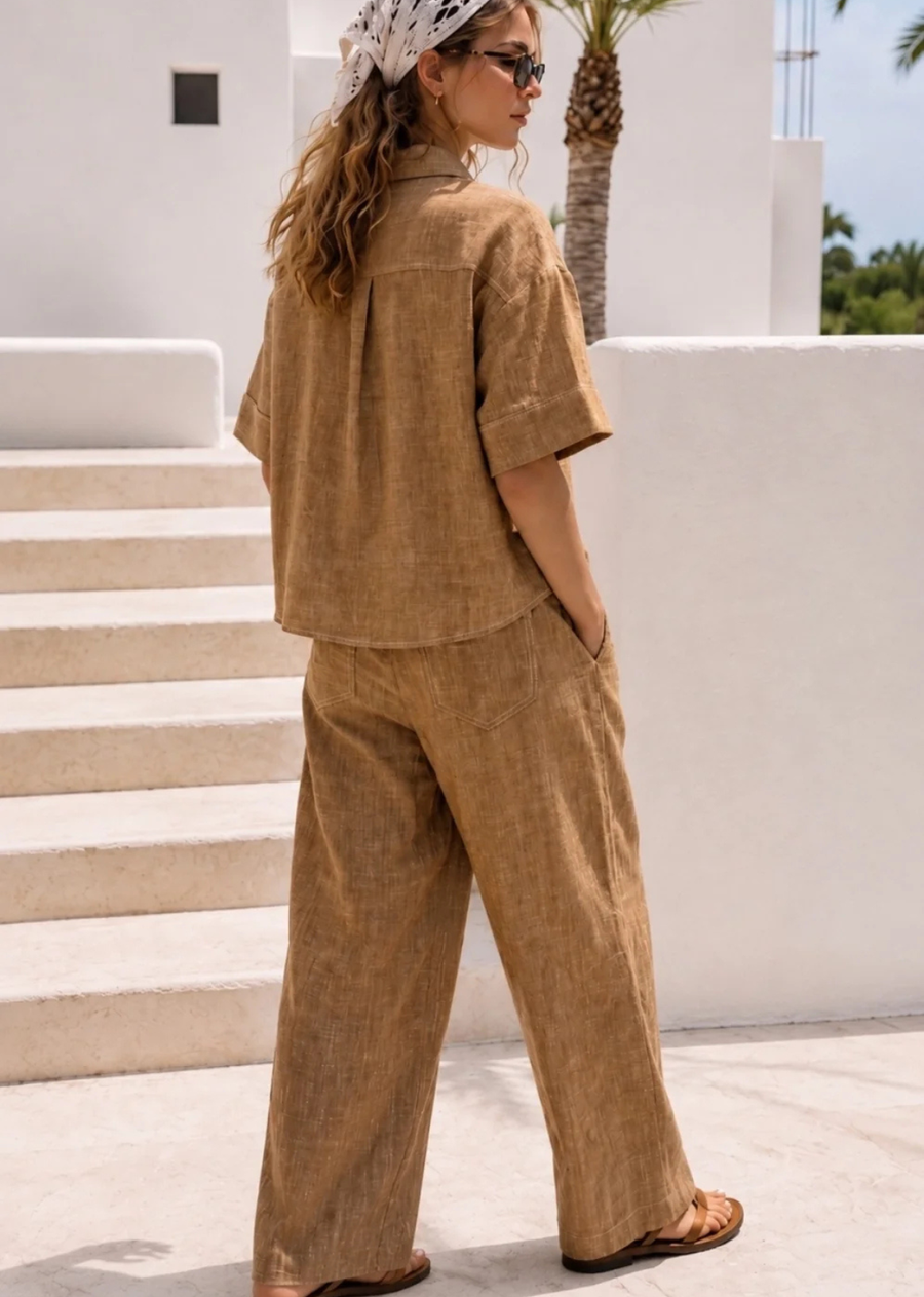 Effortlessly polished and designed for everyday wear, The Marina Linen Camp Pant - Brown offers a relaxed yet elevated fit. Crafted from a lightweight linen-cotton blend, these pants feature a soft textured finish and an easy silhouette that provides comfort without compromising style. Perfectly paired with The Marina Linen Camp Shirt for a coordinated look or styled separately with your favourite basics.