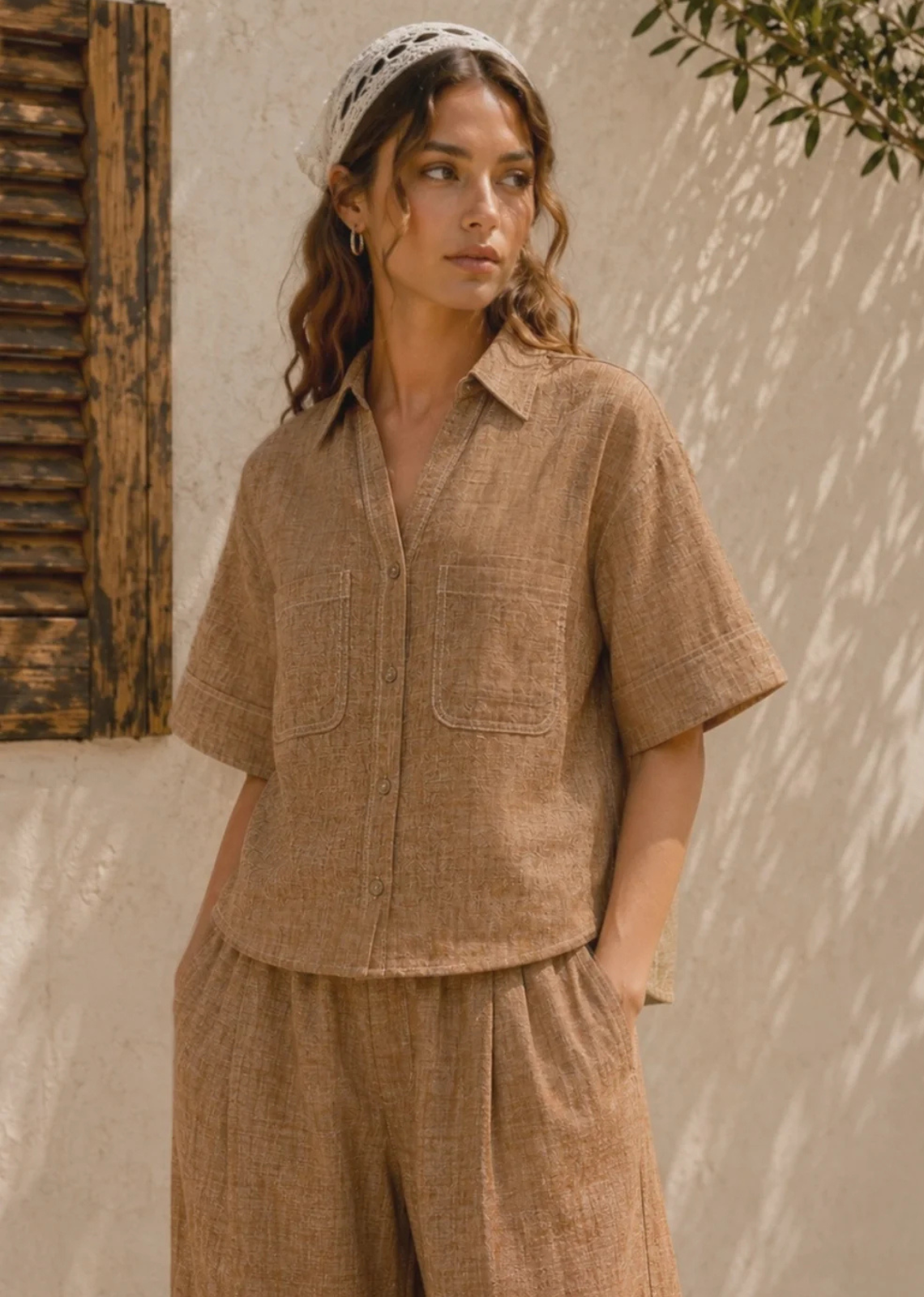 The Marina Linen Camp Shirt - Brown is the perfect warm-weather staple. Crafted from a breathable linen-cotton blend, this lightweight button-up features a relaxed boxy silhouette, classic camp collar, and oversized patch pockets for an elevated yet casual look. Contrast stitching adds a modern touch, while the textured fabric creates an easy, laid-back style perfect for vacations, beach days, and everyday wear.