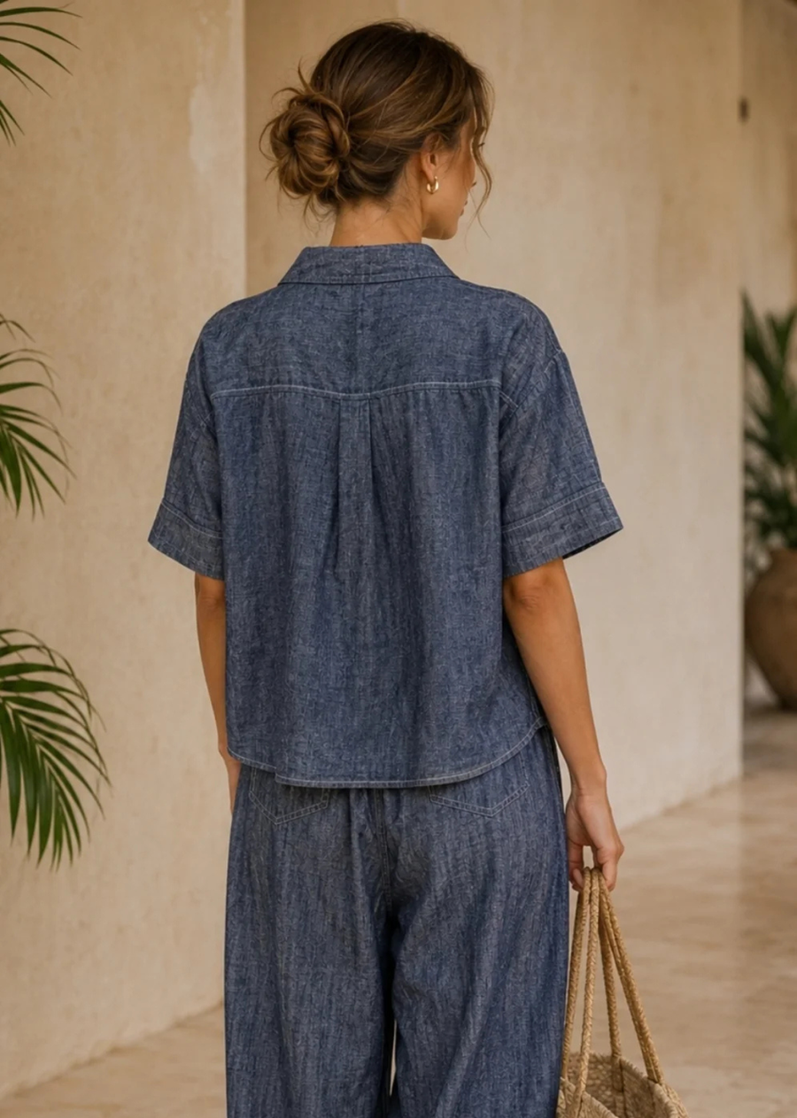 The Marina Linen Camp Shirt - Denim Blue is the perfect warm-weather staple. Crafted from a breathable linen-cotton blend, this lightweight button-up features a relaxed boxy silhouette, classic camp collar, and oversized patch pockets for an elevated yet casual look. Contrast stitching adds a modern touch, while the textured fabric creates an easy, laid-back style perfect for vacations, beach days, and everyday wear.