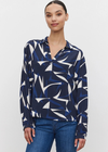 Velvet Carah Top. This V-neck top features a classic button front with collar for a flattering fit. The modern print on the royal crepe fabric makes it perfect for special occasions. The button-up front adds a touch of sophistication.