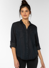 Velvet Heart Riley Shirt- Indigo Overdye. The Riley collared button-up shirt features rolled tab sleeves, double chest pockets, and a split back tail. This shirt is a perfect staple to any wardrobe.