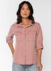 Velvet Heart Talma Shirt- Muted Mauve. This shirt features roll tab sleeves, a button front, flap chest pockets, and a slight high-low hem. This eco-friendly shirt drapes comfortably providing an effortless, casual fit.