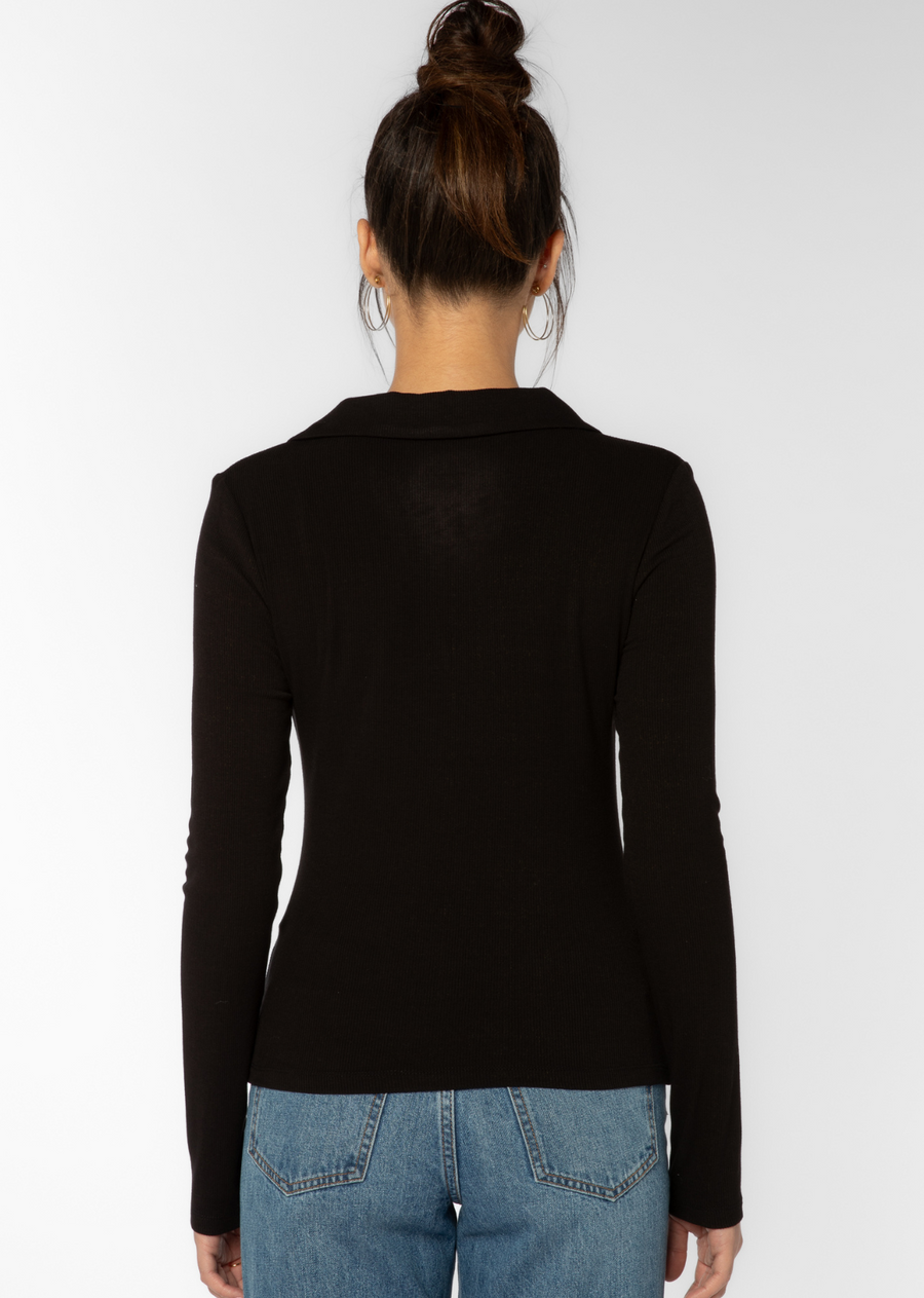 Velvet Heart Cielo Top.Sleek wardrobe staple. A super smooth and soft ribbed button up shirt with figure-flattering ruching detail down the front. An elevated basic to pair back to any bottom - wear alone or layer under a blazer for the office.