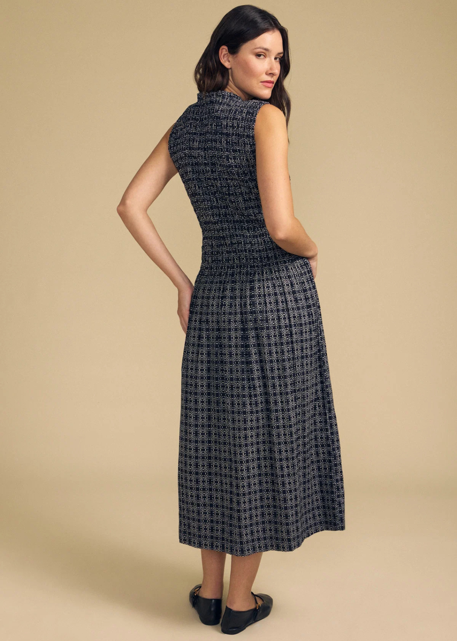 Sweet and effortless, the Katherine is a floral grid printed dress crafted from cotton. It features a sleeveless silhouette, a ruffle neckline, and a smocked elastic bodice that flows into a lined a-line skirt. The soft cotton drapes with an easy, breezy movement that flatters every body. A charming go-to for warm-weather days, from brunch to backyard gatherings.