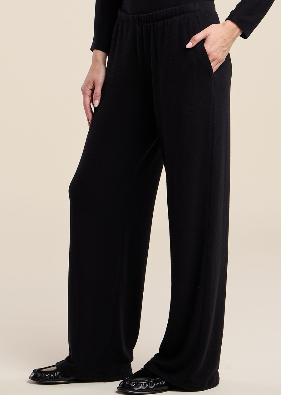 Elevated loungewear meets everyday ease in the Mackenzie lounge pant, crafted from a soft, brushed knit. It features a wide leg silhouette, an elastic pull-on waist, and slash pockets for effortless comfort. The soft knit offers a plush hand-feel that drapes beautifully without losing its shape. Pair it with the Beatrice cardigan or Cecilia top for an easy, coordinated look.