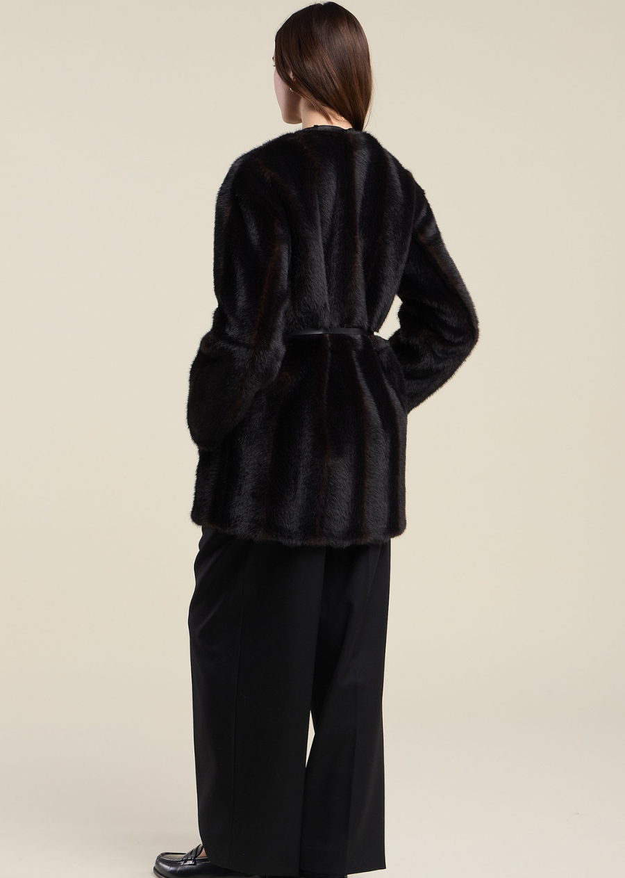 Crafted from luxe faux fur, this jacket offers rich texture and an irresistibly soft feel while bringing warmth and sophistication to any look. Designed with snap button closures, front slash pockets, and a detachable faux leather belt, it delivers a chic, elevated finish that instantly enhances any outfit.