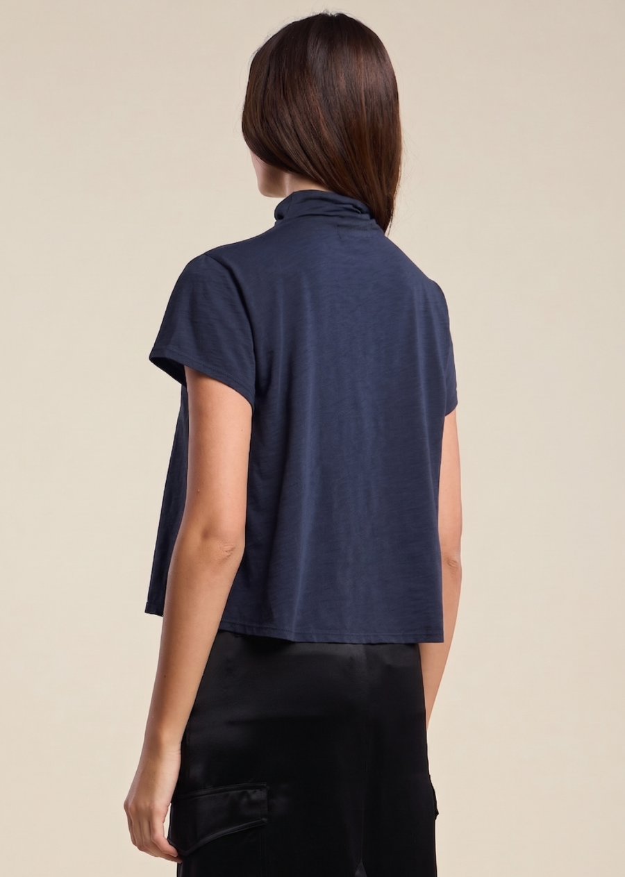 A modern update to your everyday tee. Crafted from soft, lightweight cotton slub, this boxy silhouette with ultra-short sleeves is finished with a relaxed turtleneck for a laid-back yet elevated look. An easy essential that pairs effortlessly with denim, trousers, or layered under outerwear.