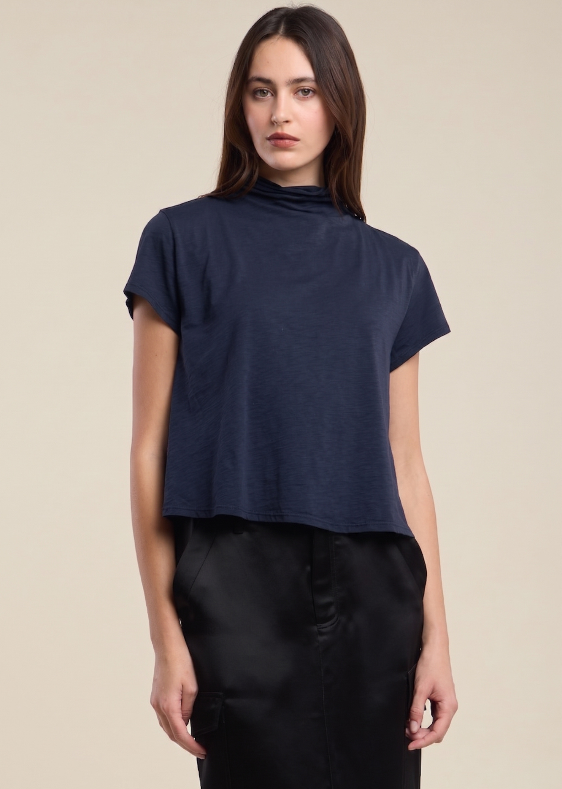 A modern update to your everyday tee. Crafted from soft, lightweight cotton slub, this boxy silhouette with ultra-short sleeves is finished with a relaxed turtleneck for a laid-back yet elevated look. An easy essential that pairs effortlessly with denim, trousers, or layered under outerwear.