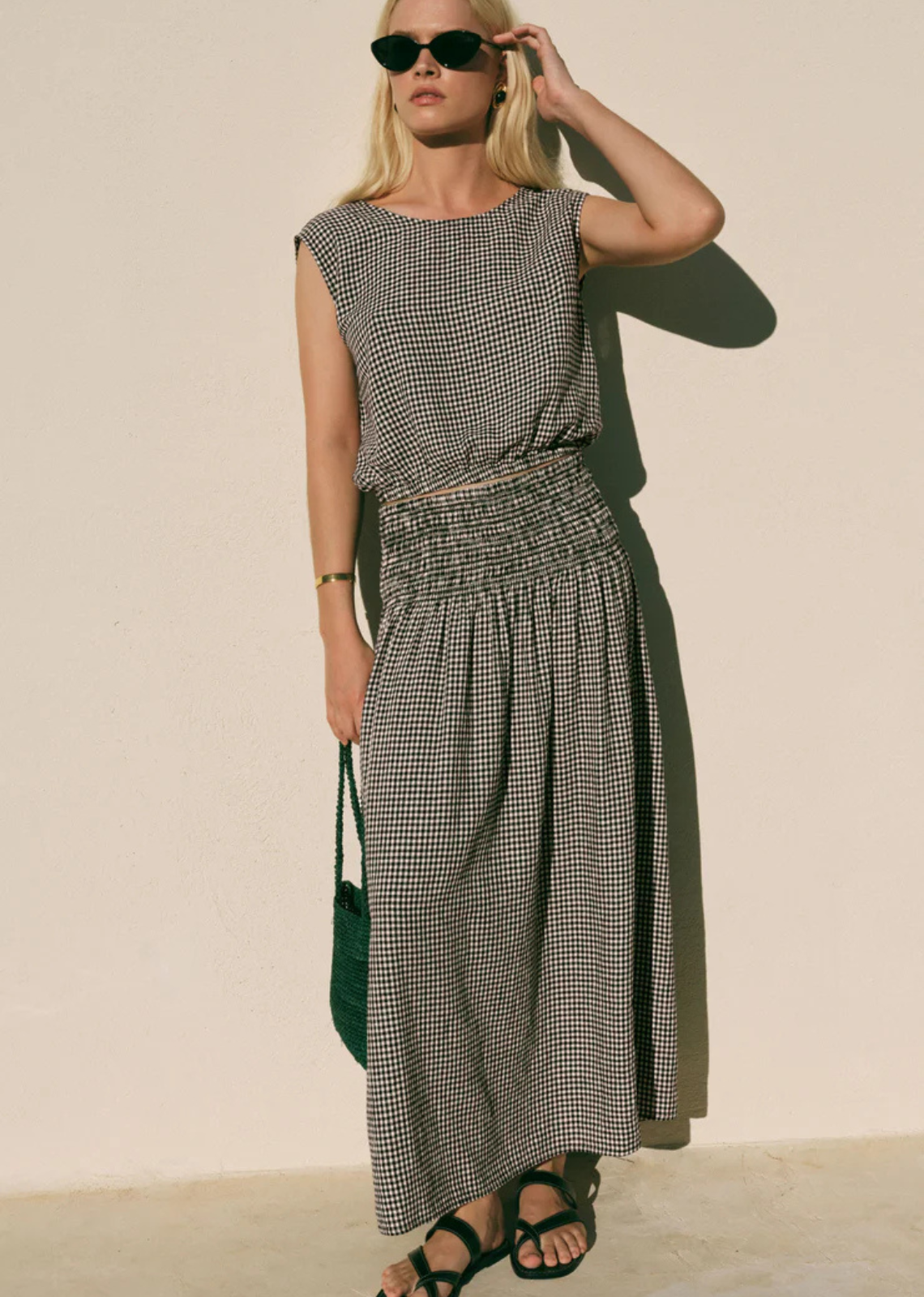 There’s something about this gingham skirt that just makes getting dressed feel lighter. The unlined, lightweight fabric moves as you walk, giving it that effortless flow, while the smocked waistband keeps everything comfortable. Perfect for every day and beyond. Pair with your favorite knit or the matching top.