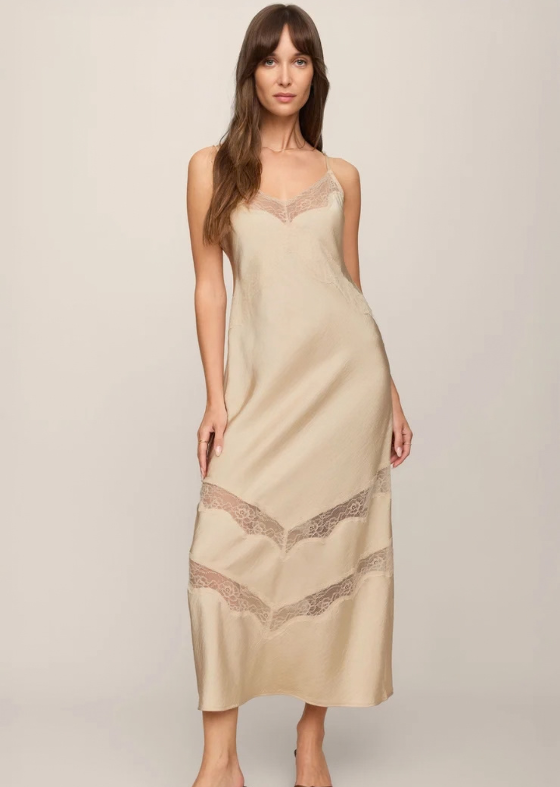 Crafted from lightweight luxe satin, this unlined midi dress features sheer lace insets and adjustable straps that keep the fit feeling easy. The result is a dress that feels just as right for an impromptu dinner as it does for the plans circled on your calendar.