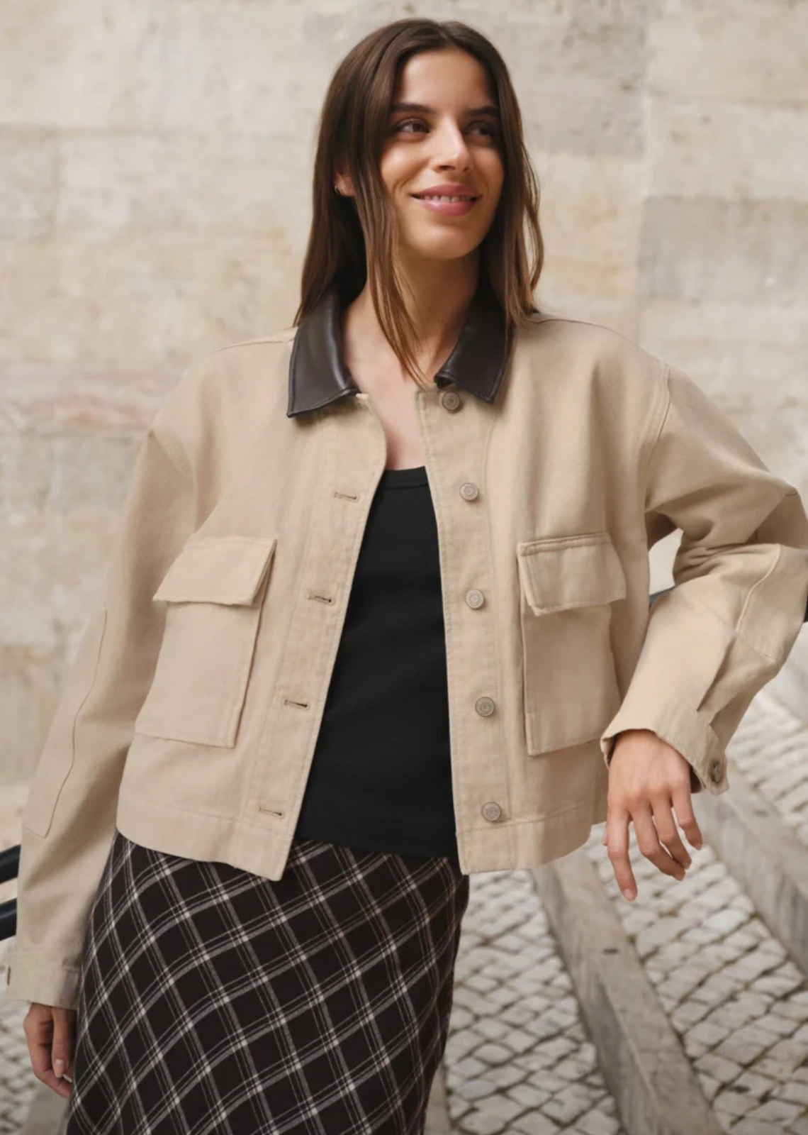 Some jackets do more than finish an outfit. This one helps create it. Designed in 100% cotton Modern Vintage Denim with a faux leather collar, oversized utility pockets, and pleated cuff details, it blends workwear inspiration with a cropped silhouette that feels right at home in a modern wardrobe.