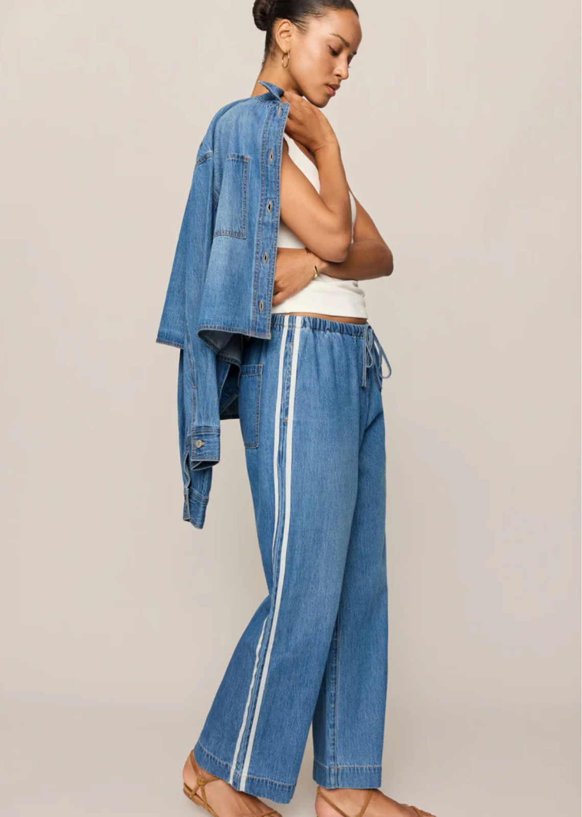 Sporty details and soft denim give these bestselling track pants an effortlessly cool feel.