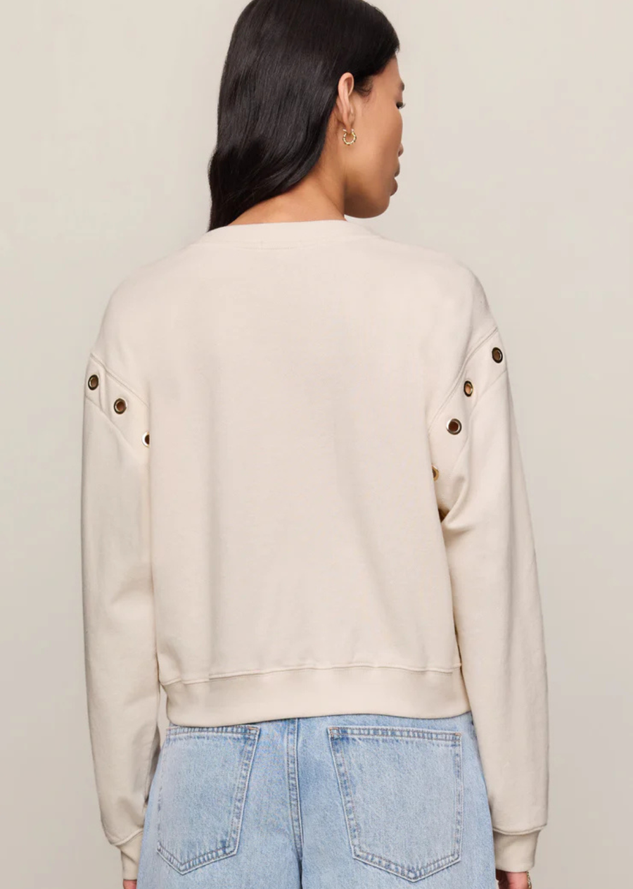 A 100% cotton French terry sweatshirt with gold hardware that adds just enough edge.