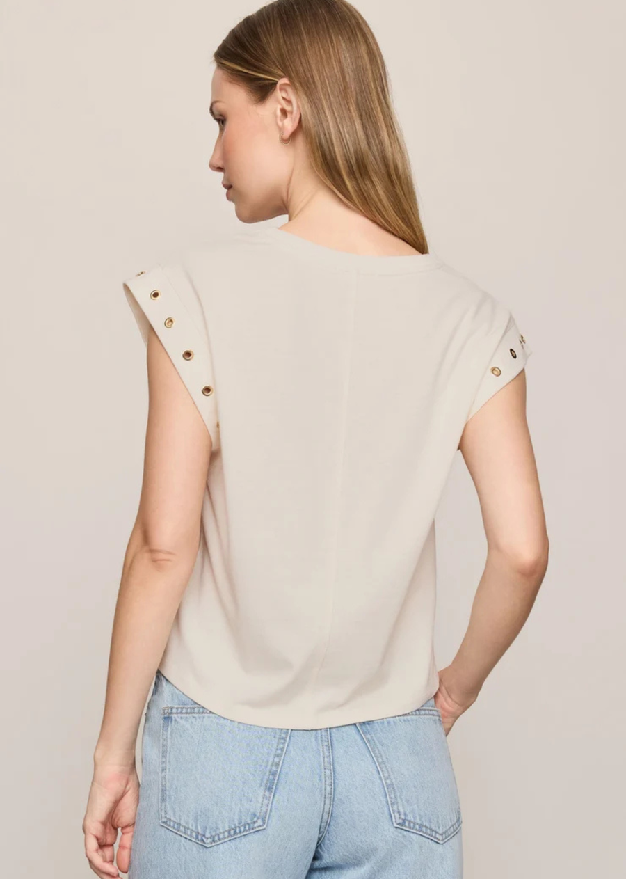 Made from soft jersey with an easy drape, this relaxed muscle tee brings a fresh update to an everyday favorite. Gold metal grommets along the arm openings add a distinctive finish, while the relaxed silhouette pairs easily with denim, trousers, or layered under a jacket.