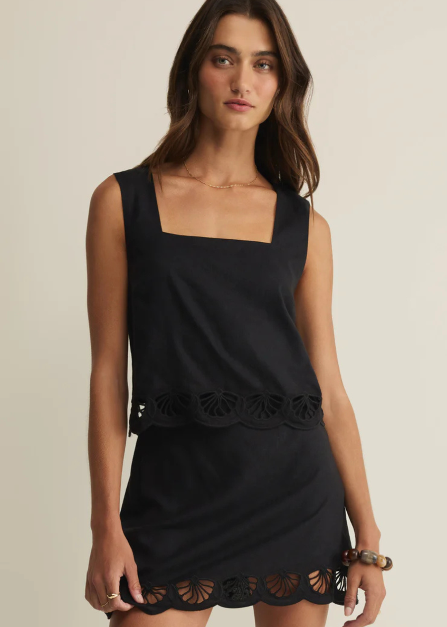Crafted in an airy linen fabric, this relaxed cropped top features a square neckline and statement shell embroidery along the scalloped hem. Style it with its matching mini skirt for a feminine day-to-dinner-date coordinated set