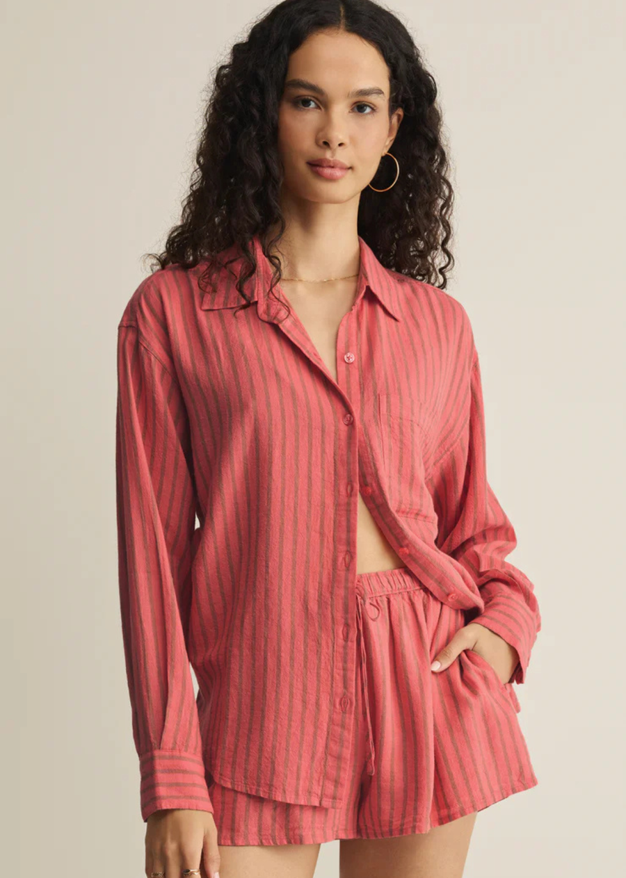 A fresh take on a classic, this linen button up shirt features a relaxed drape and subtle texture. Vertical stripes have a flattering effect, while a relaxed collar, chest pocket, long sleeves, and curved hem make it easy to wear layered or half-tucked.