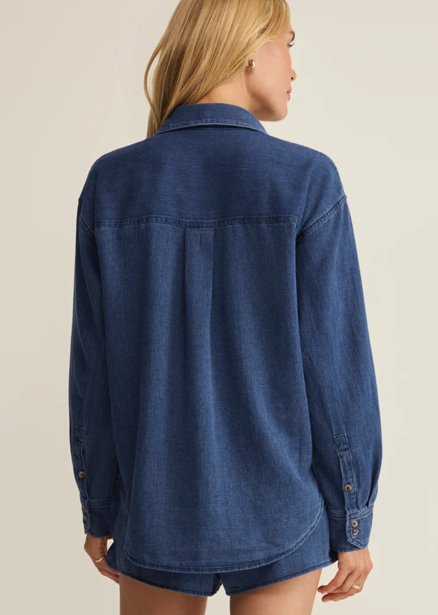This twill button-up has that borrowed-from-someone-good taste kind of feel. Made from soft indigo cotton twill, it’s relaxed with a drape that makes it easy to wear tucked, layered, or tossed on open over a tank. The kind of piece that naturally becomes part of your everyday rotation.