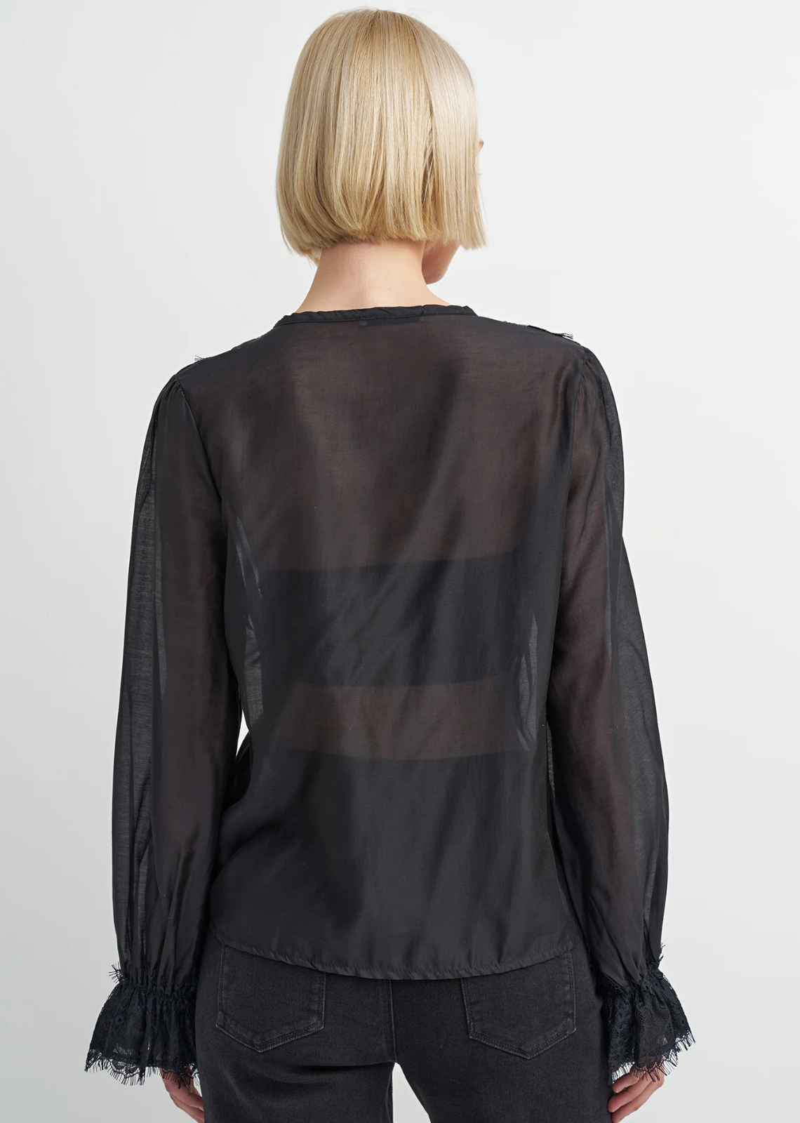 Black lyocell-blend blouse with soft draping, feminine detailing, and a flattering silhouette, designed with a subtle Western-inspired aesthetic.