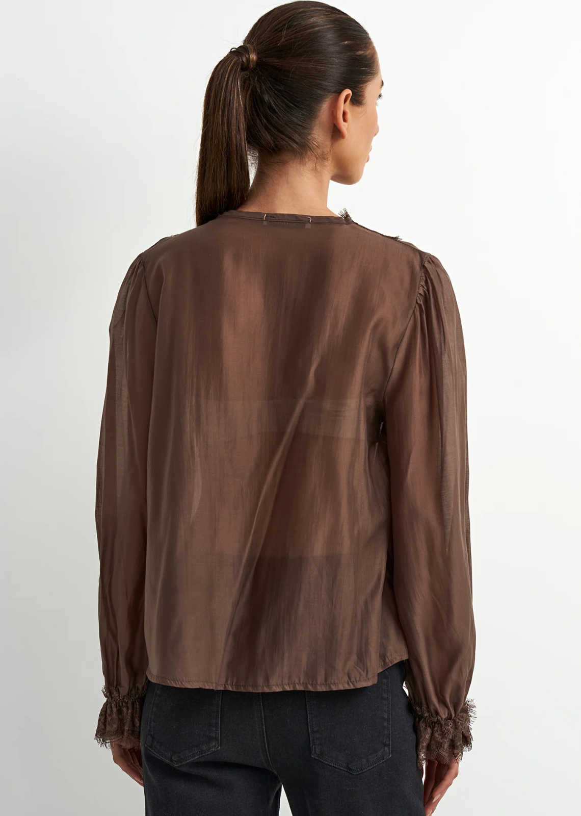 Brown lyocell-blend blouse with soft draping, feminine detailing, and a flattering silhouette, designed with a subtle Western-inspired aesthetic.