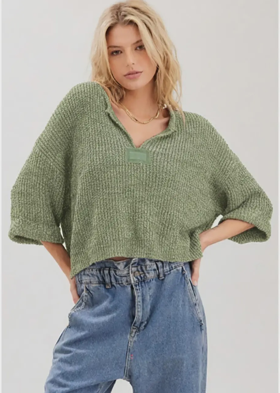 Our signature slouchy cropped sweater featuring v-neckline, 3/4 sleeves, and solid patch at front and back. Wearable all year round.