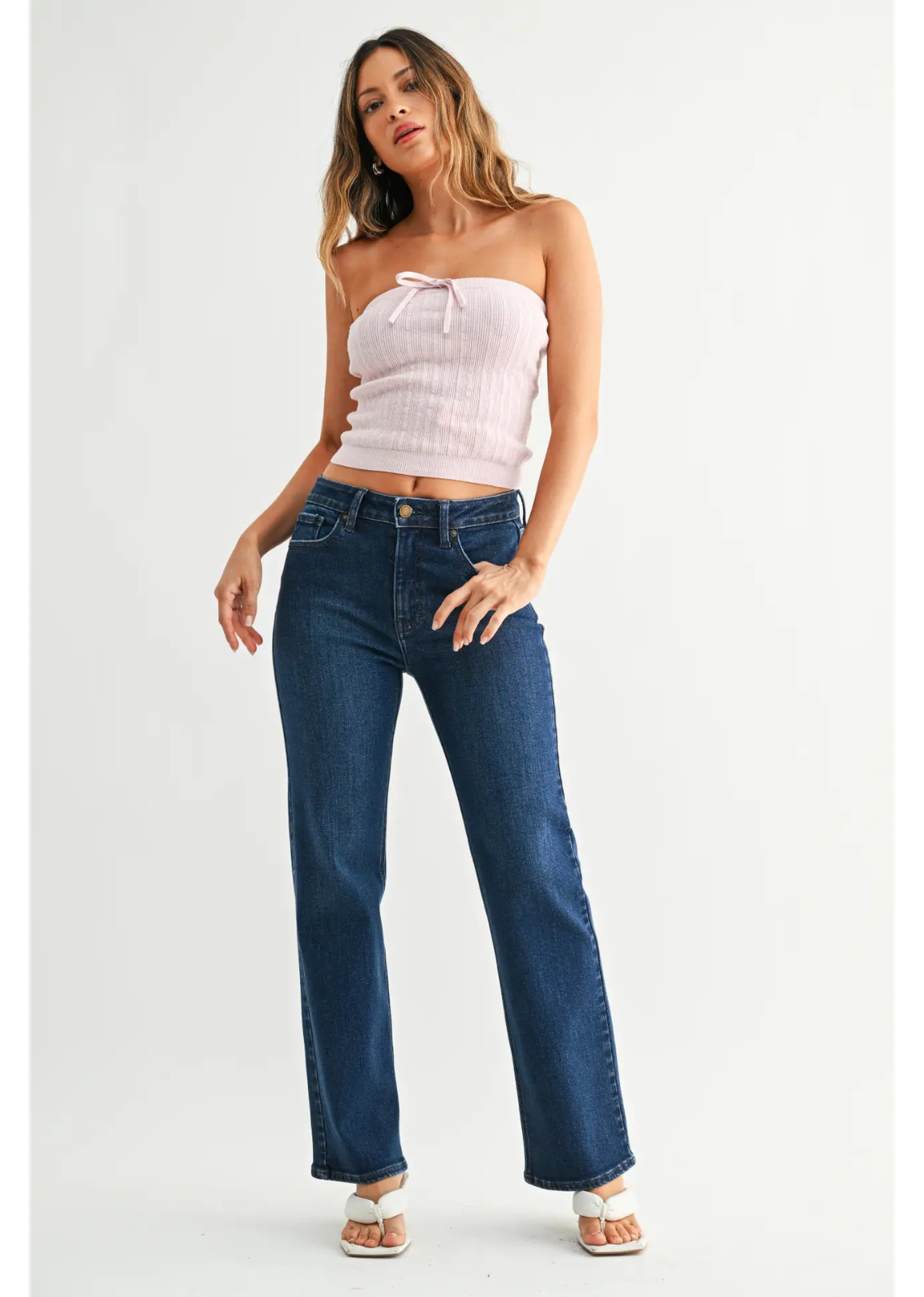 Dark denim straight-leg jeans with a mid-rise waist, comfortable fit through the hip and thigh, full-length legs, and an 8.5-inch leg opening.