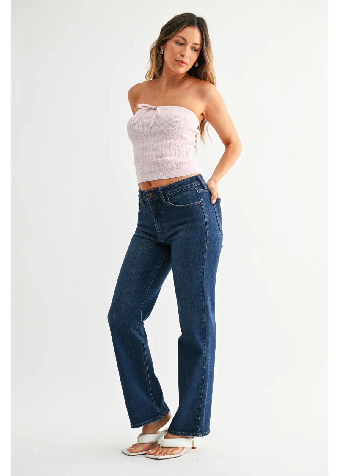 Dark denim straight-leg jeans with a mid-rise waist, comfortable fit through the hip and thigh, full-length legs, and an 8.5-inch leg opening.