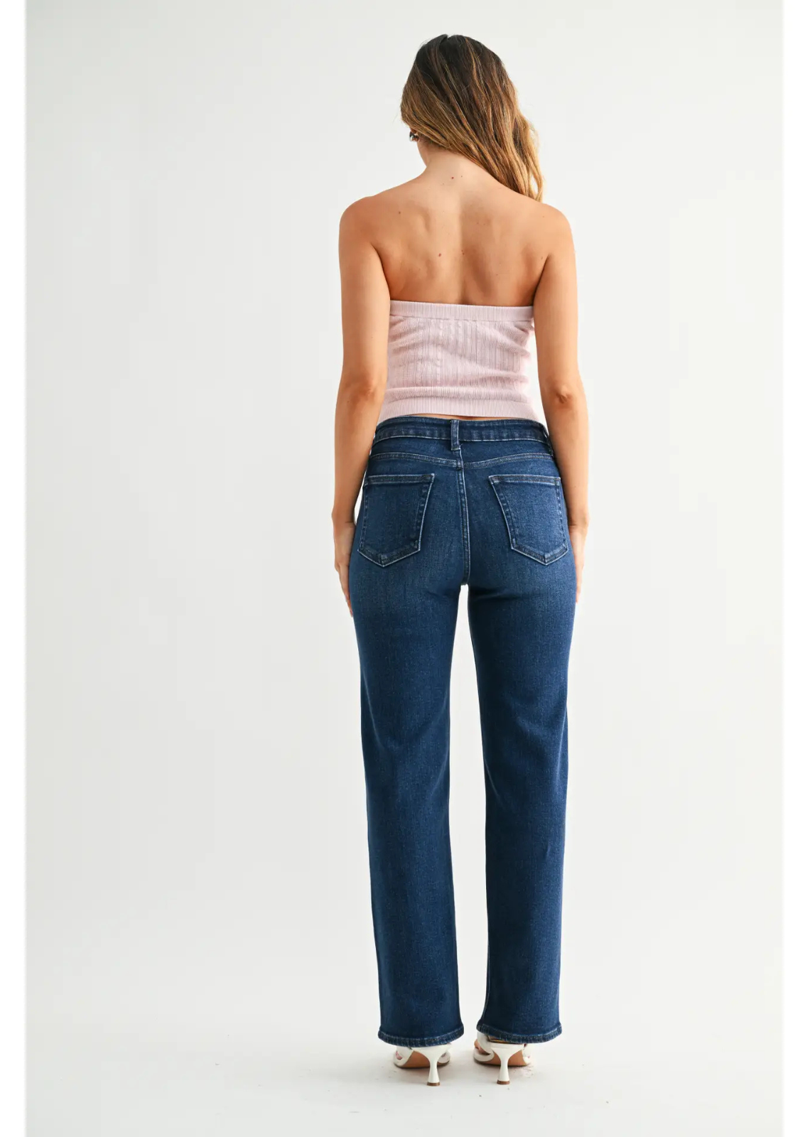 Dark denim straight-leg jeans with a mid-rise waist, comfortable fit through the hip and thigh, full-length legs, and an 8.5-inch leg opening.